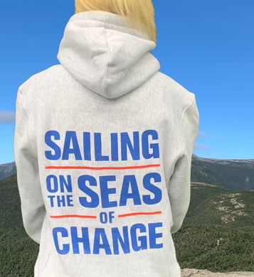 Sailing on the Seas of Change grey sweatshirt with blue lettering